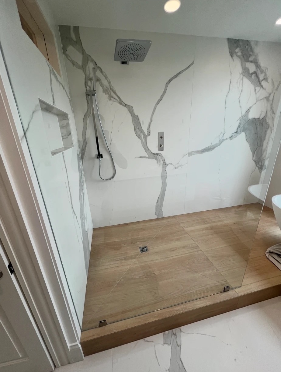 Shower detail: rain head, hand shower, niche and center drain